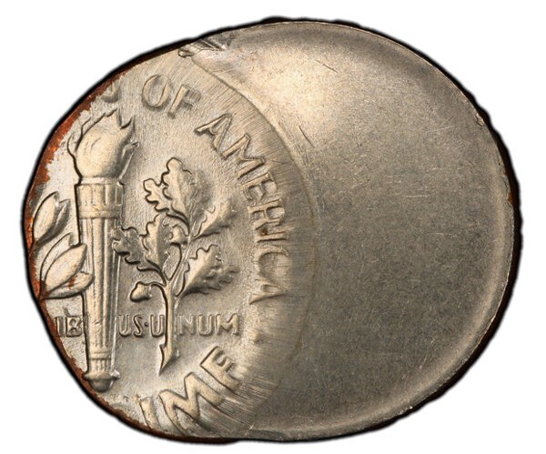 1960 Roosevelt dime off-center strike error showing partial design with blank planchet area visible at one edge